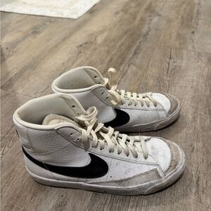 Nike White High-Top Sneakers with Black Logo